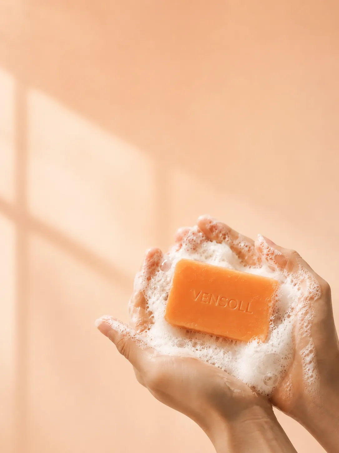 Vensoll Japanese persimmon soap bar lathering in hands